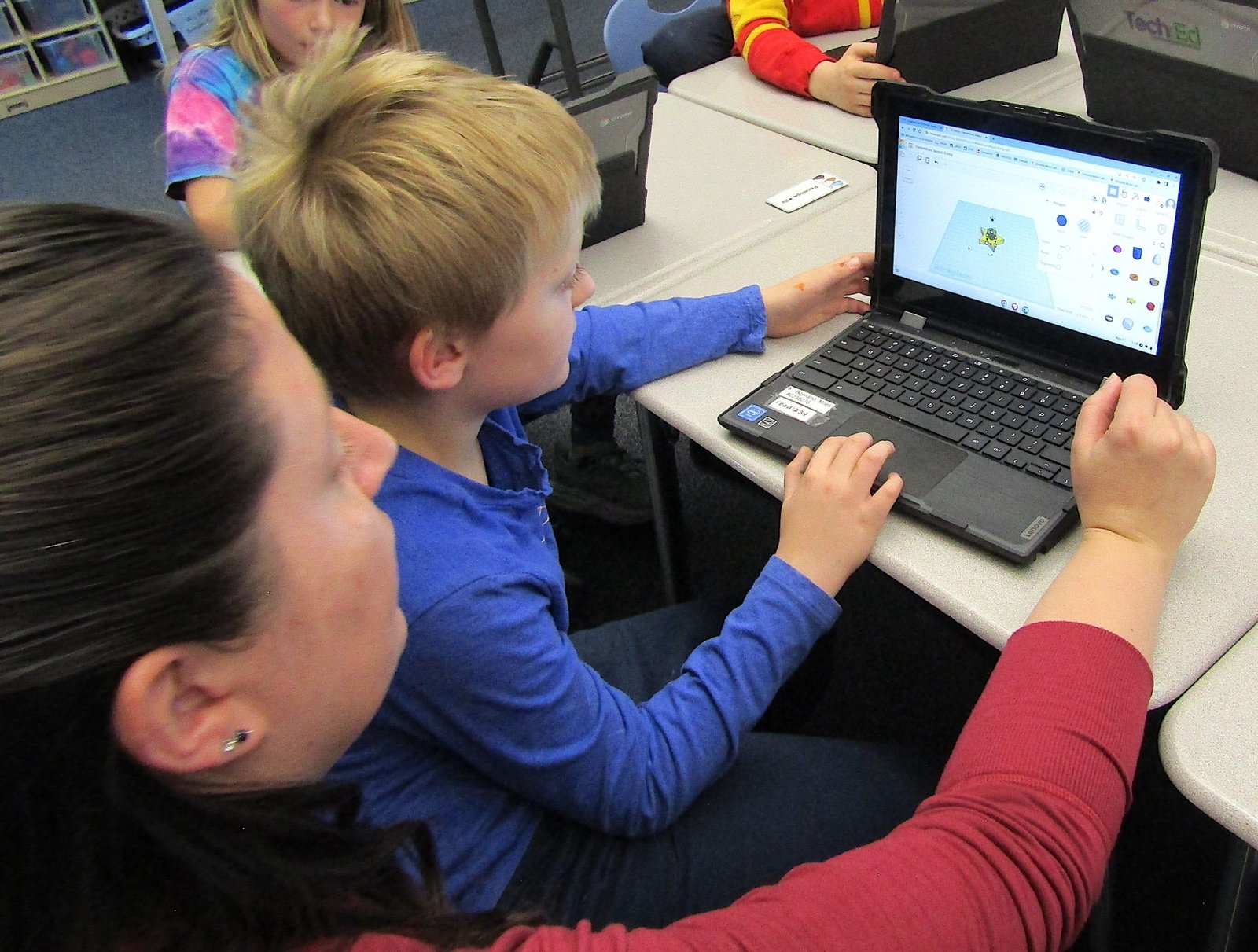 Second graders at Parmalee Elementary learn the technology to create with a 3D printer
